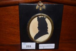 Small silhouette picture set in an ebonised frame with oak leaf and ringlet mount