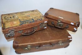 Three various assorted small suitcases