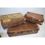 Three various assorted small suitcases