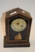 Small mantel clock by The Red Star Clock Company with decorated glass door