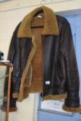 Brown sheepskin jacket labelled to the interior Genuine Sheepskin Leather (M)