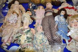 Large mixed lot of various porcelain headed and composition dolls, various states of repair