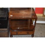 Victorian rosewood two tier side table with single base drawer and turned legs with casters