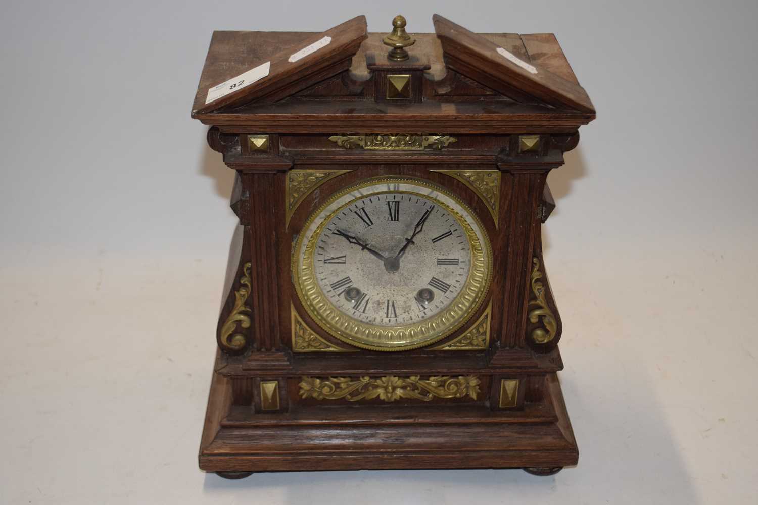 Late 19th Century mantel clock with oak and brass mounted architectural case