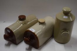 Three stone ware hot water bottles