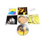 A collection of Genesis 12" vinyl LPs and picture discs, to include: - Limited Edition Interview