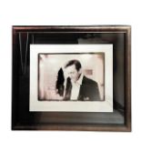 A framed and glazed photograph of Johnny Cash by Swedish Photographer Jan Olofsson, signed by both