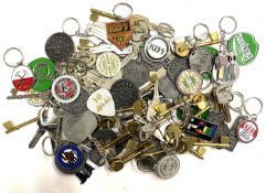 A large quantity of metal keyrings of music interest, to include: - The Beatles - KISS - Def Leppard