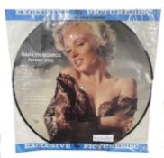 A Marilyn Monroe 'Runnin Wild' vinyl LP picture disc, in original packaging with original