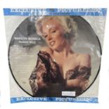 A Marilyn Monroe 'Runnin Wild' vinyl LP picture disc, in original packaging with original
