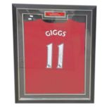 A framed and glazed Manchester United shirt signed by Ryan Giggs, #11. COA to rear, from