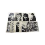 A set of collectable cards by A&BC Chewing Gum Ltd, depicting the Beatles and their printed