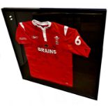 A framed and glazed signed Rugby Union number 6 shirt - Wales v Italy (Cymru v Yr Eidal, 11th