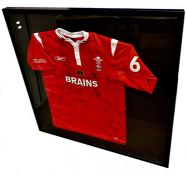 A framed and glazed signed Rugby Union number 6 shirt - Wales v Italy (Cymru v Yr Eidal, 11th