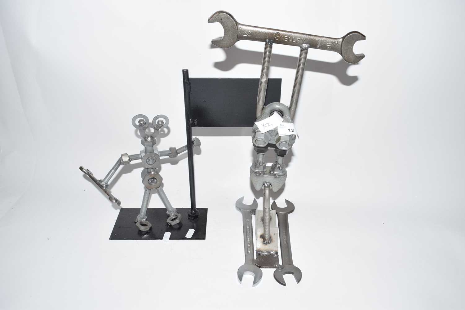 Two novelty metal figures formed from spanners, bolts, nuts and other metal items