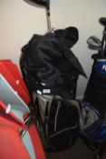 Black Wilson golf bag containing various clubs