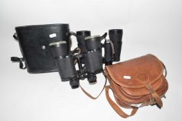 Pair of Oniya 10x50 binoculars with a pair of 7x 50 binoculars with leather case