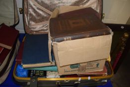 Suitcase containing various assorted books