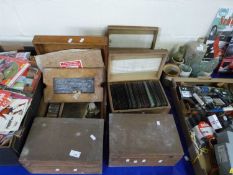 Six cases of photographic glass slides