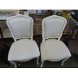 Pair of modern continental style dining chairs with cream finish frames