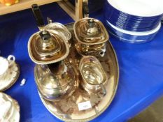 A four piece silver plated tea set and accompanying tray