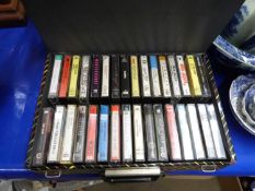 Box of various audio casettes