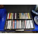 Box of various audio casettes