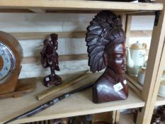 Mixed Lot: A carved Balinese small root wood figure, hardwood paper knife and glove stretchers