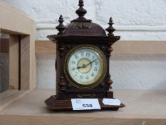 Small continental mantel clock in architectural case