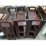Four dark stained folding bookcases