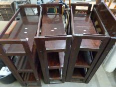 Four dark stained folding bookcases