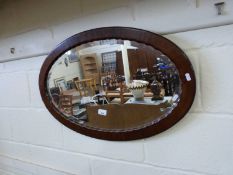 Oval bevelled wall mirror