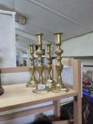 Two pairs of brass candlesticks