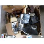 One box of vintage telephones, carved ethnic figures etc