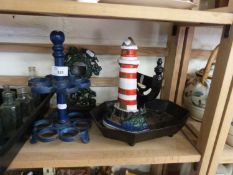 Mixed Lot: Cast iron boot scraper, lighthouse shaped door stop, two tier egg stand and a pocket