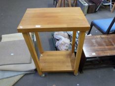 Modern light oak two tier table on wheels