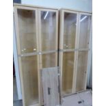 Pair of light wood corner display cabinets