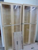 Pair of light wood corner display cabinets