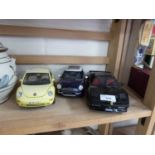 Group of three model cars