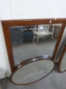 Rectangular wall mirror together with a further oval bevelled wall mirror