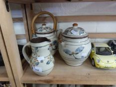 Group of three Studio Pottery items comprising teapot, covered jar and a jug marked IYA to base