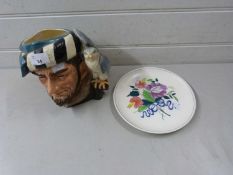 Royal Doulton character jug, The Falconer together with a Poole Pottery plate