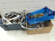 Three boxes of various taps and parts