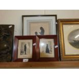 Pair of small silhouette portraits in stained wooden frames together with a further larger