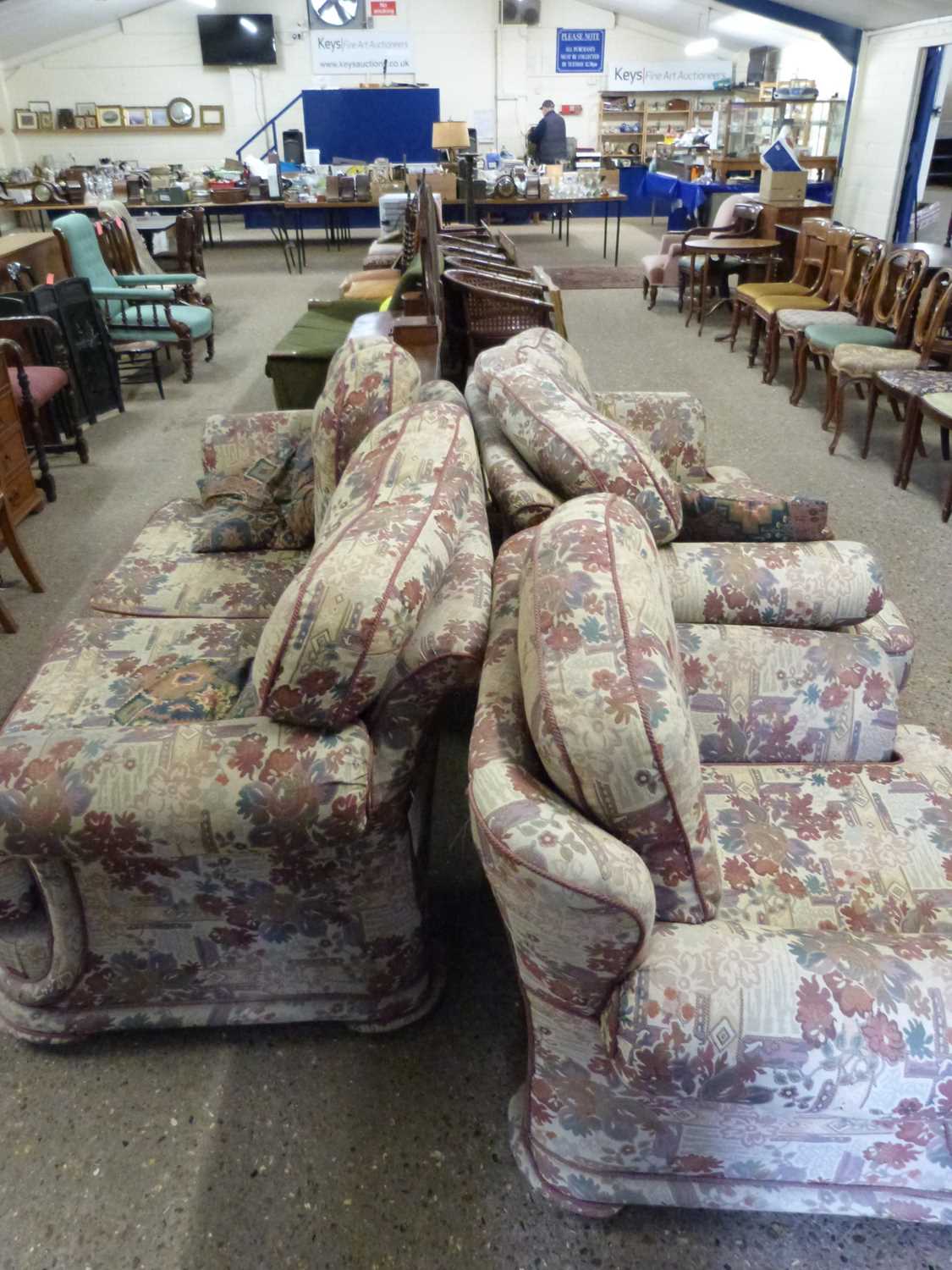 Floral upholstered three piece suite comprising a three seater sofa, two seater sofa and an armchair