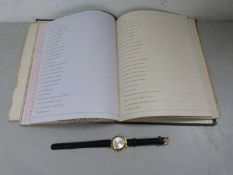 Mixed Lot: A vintage confessional album together with a ladies wristwatch