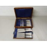 Case of mother of pearl handled dessert cutlery, the case with retailers mark for Mappin Bros London
