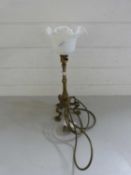 Brass stirrup type table lamp with frilled glass shade