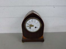 Late 19th Century mantel clock with enamelled floral decorated face set in a mahogany veneered