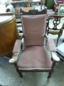 19th Century mahogany framed and pink upholstered armchair on fluted legs with casters
